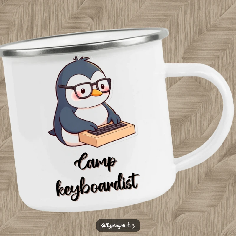 Funny camping mug of a penguin with glasses typing enthusiastically on a miniature keyboard, ideal for focused outdoor work.