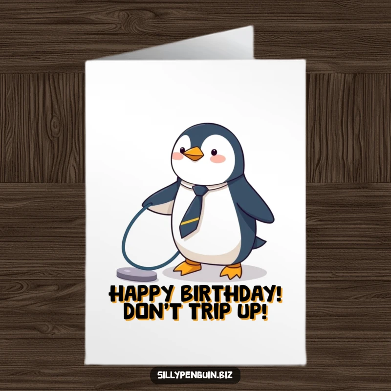 Funny Free Printable Birthday Card: A penguin in a tiny tie comically tripping over a computer cable, sending papers flying.